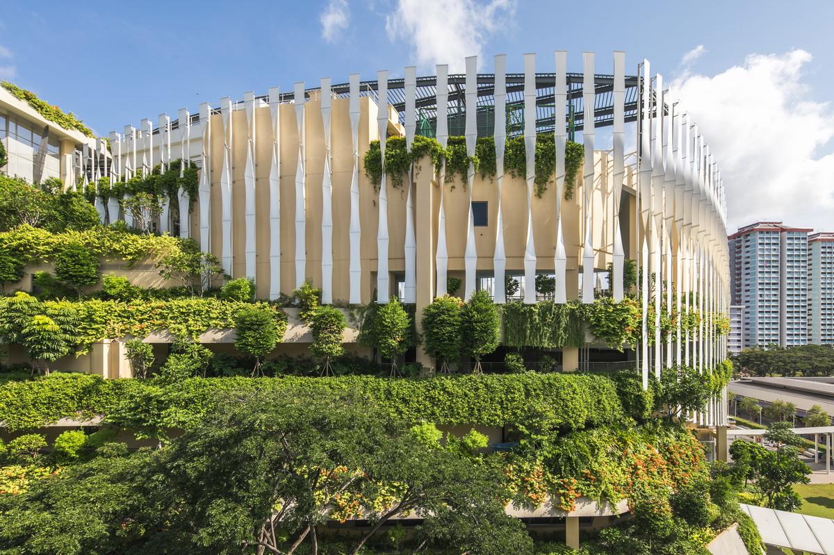 j1 - Tapered fenestrations, wrap-around tensile fabric and vertical fins help reduce solar heat gain through the facade.jpg
